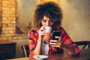 woman looking at smartphone