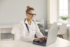 medical provider using laptop