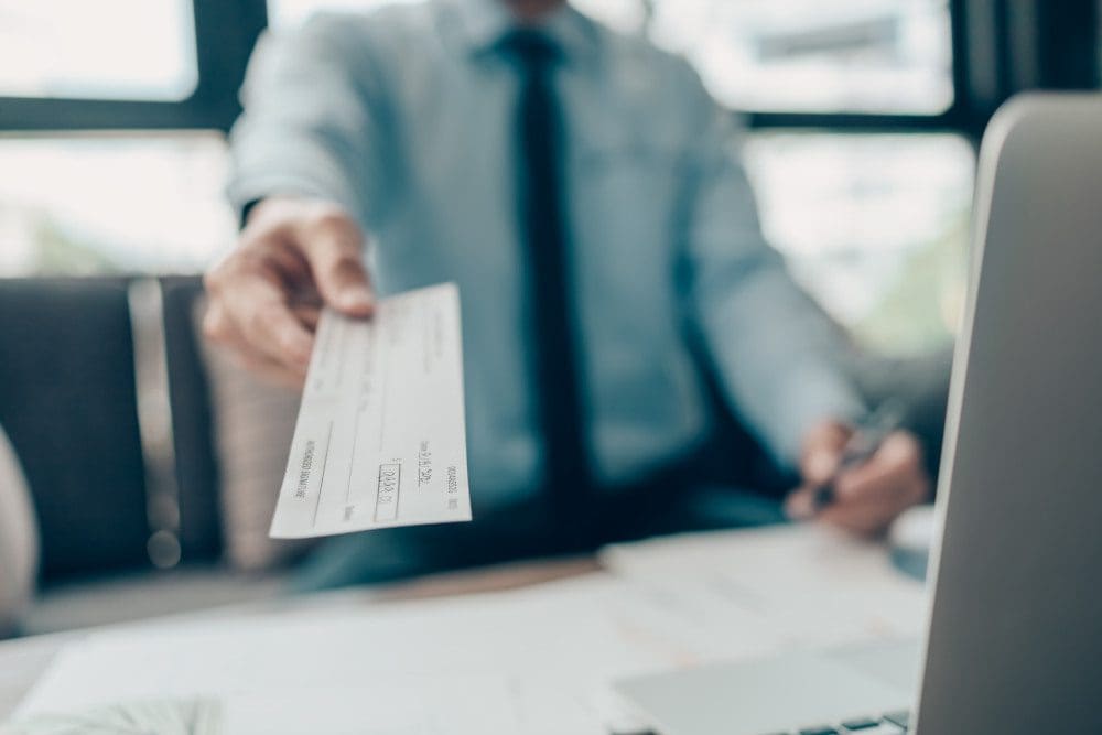 man writing a check