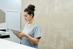 medical receptionist with ipad